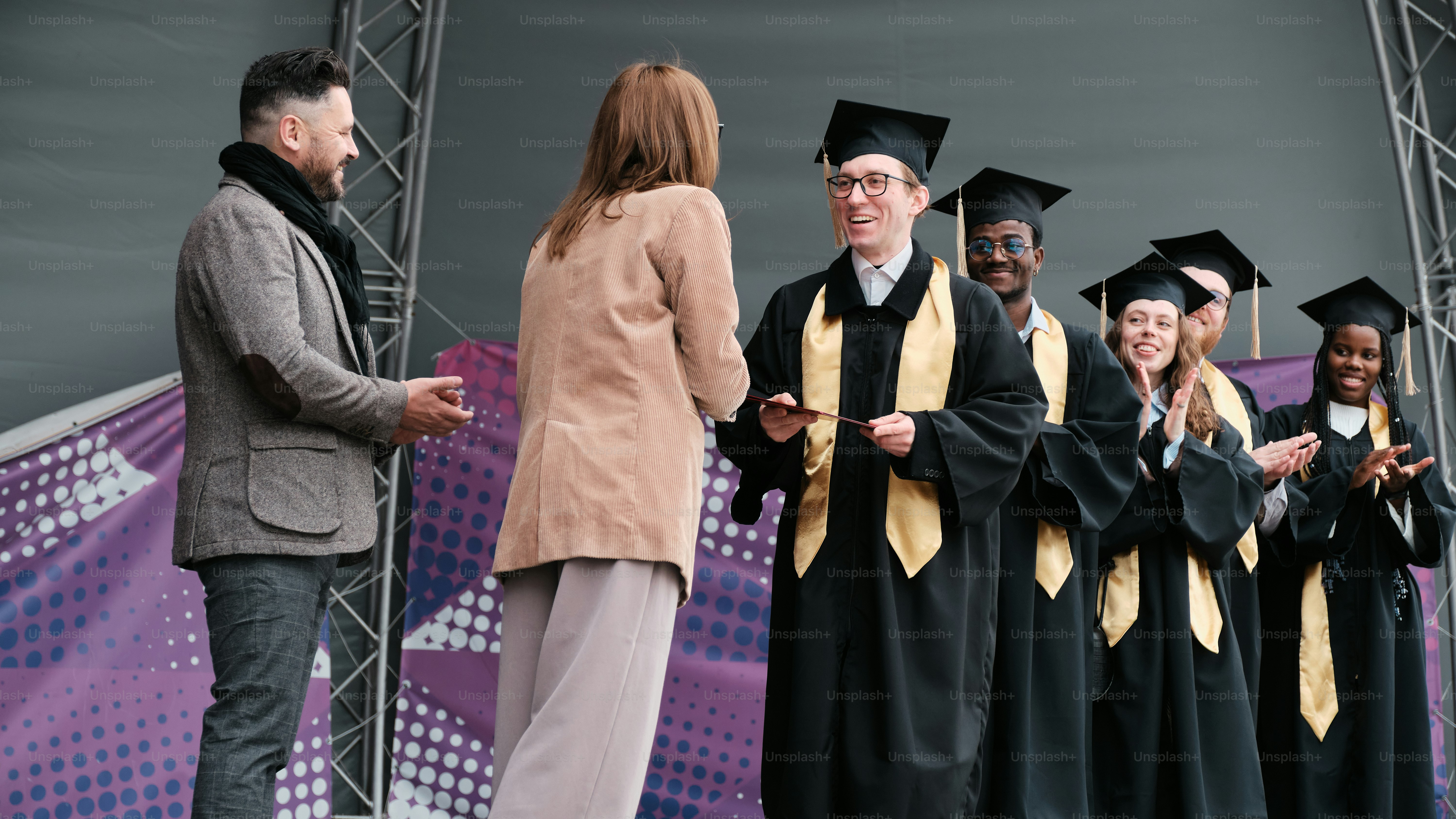 Students receiving his diploma
